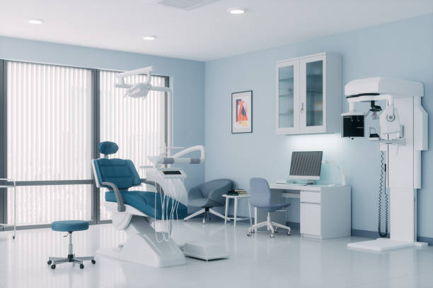 Dentist with patient and dental equipment